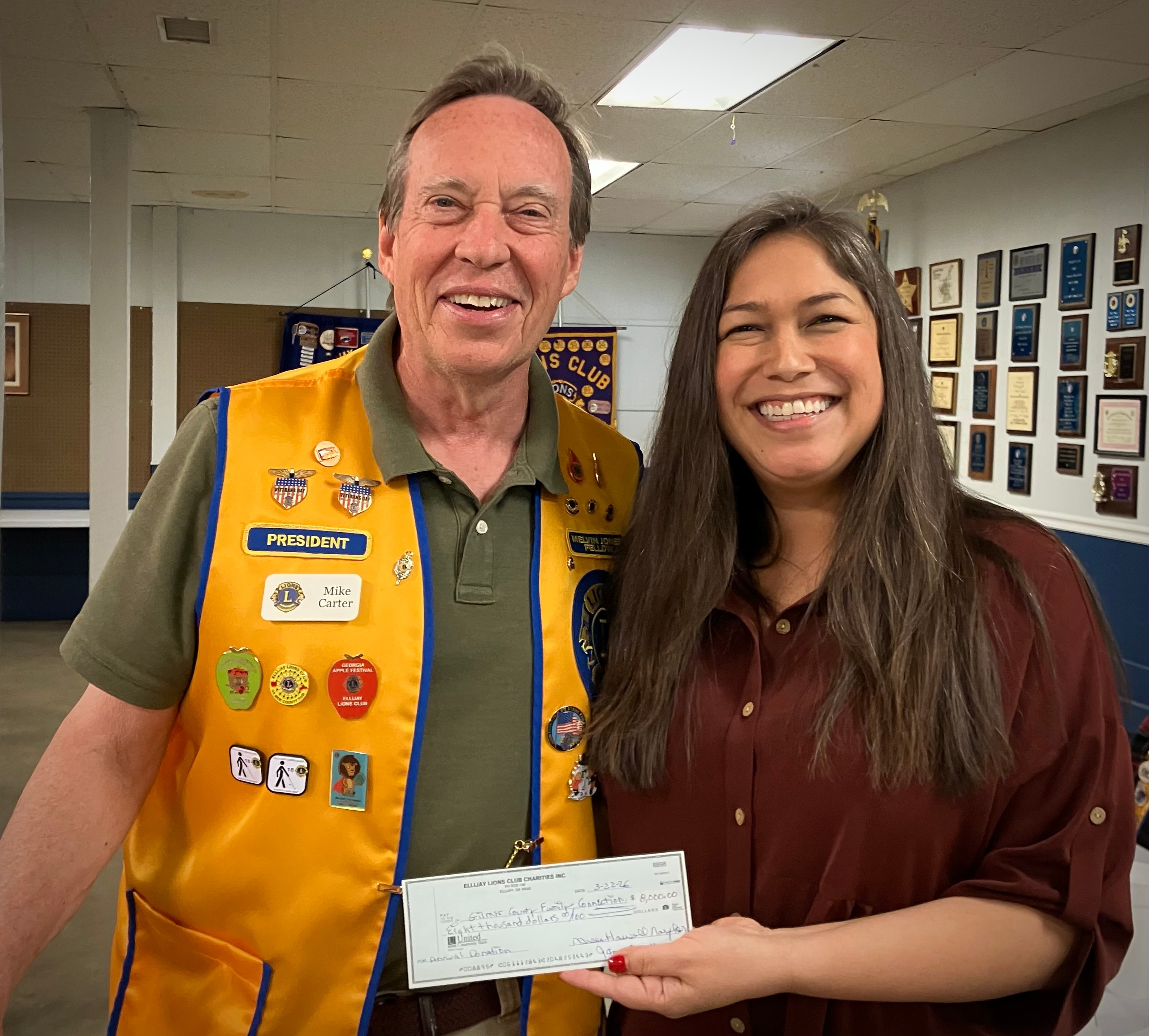 Lions Club president presenting a scholarship check at the awards ceremony