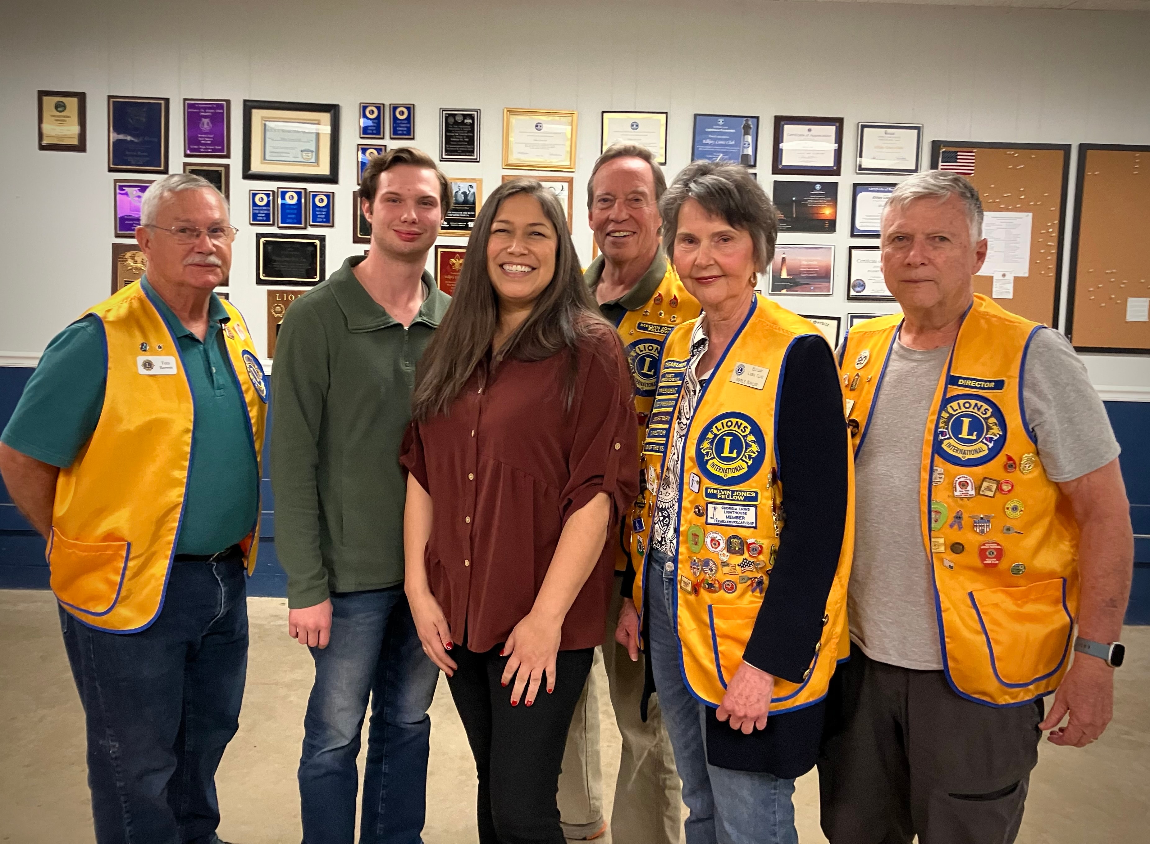 Lions Club members posing together at the awards ceremony
