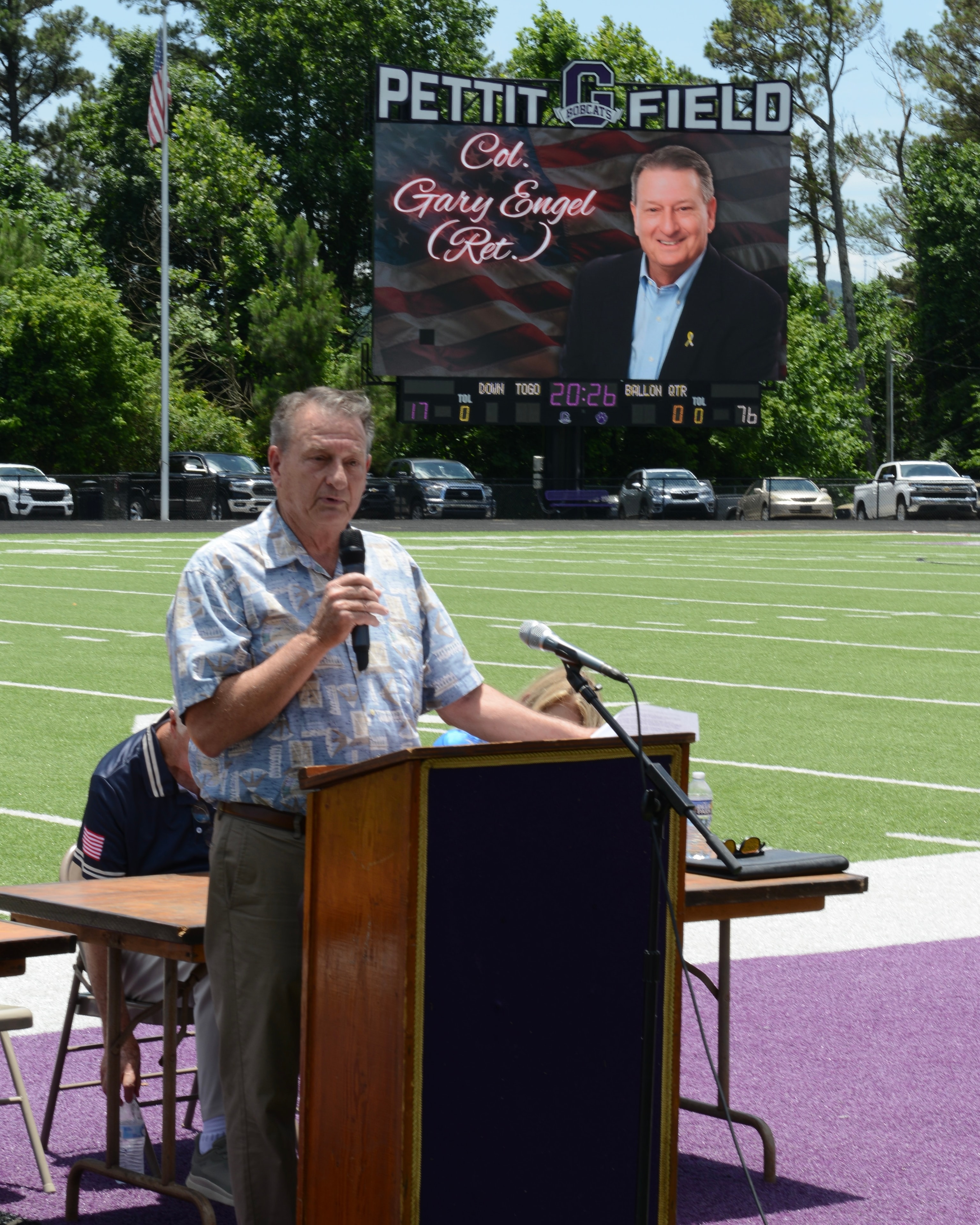 Col. Gary Engel speaking at the podium at the Flag Day ceremony at Pettit Field