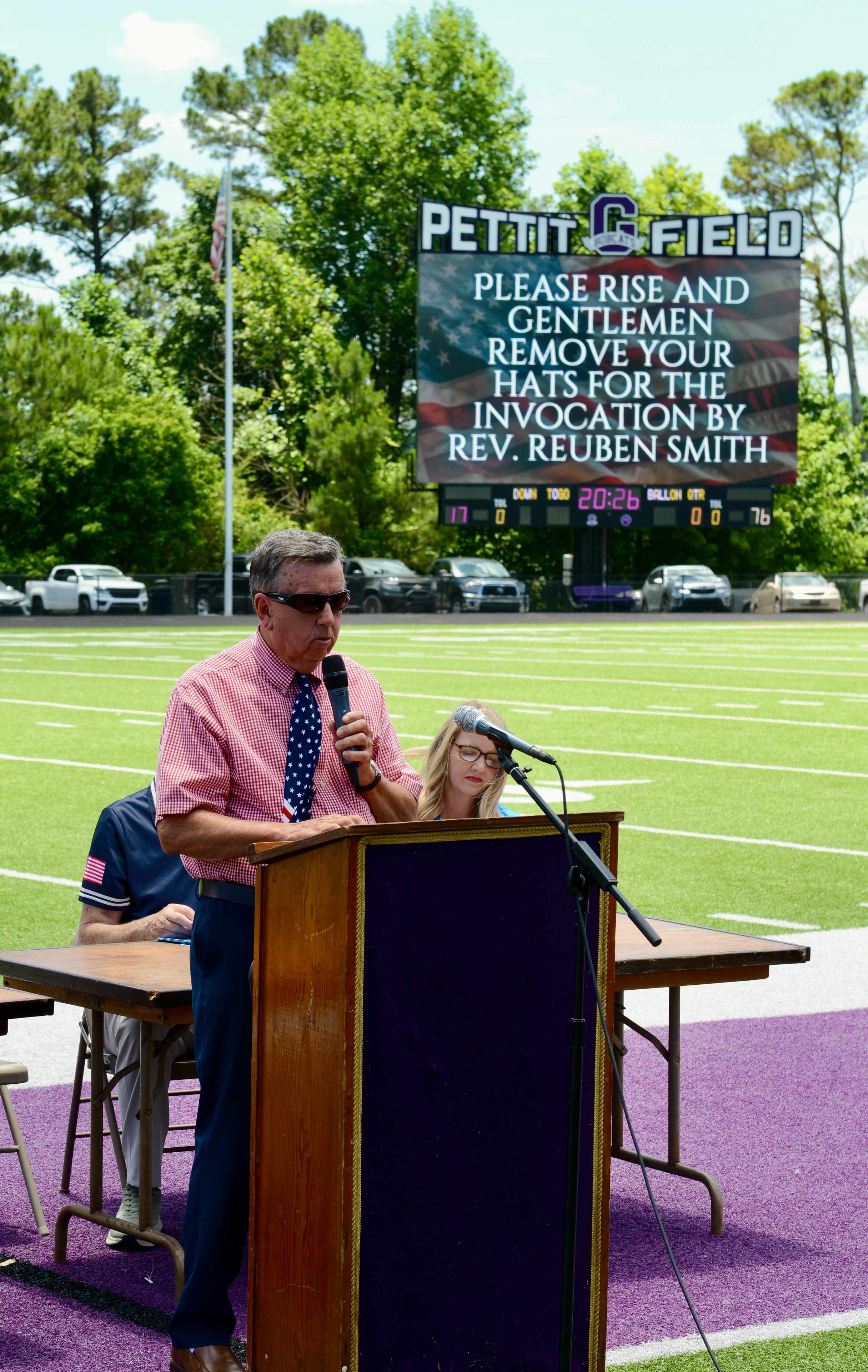 Master of ceremonies welcoming guests at the Flag Day event at Pettit Field