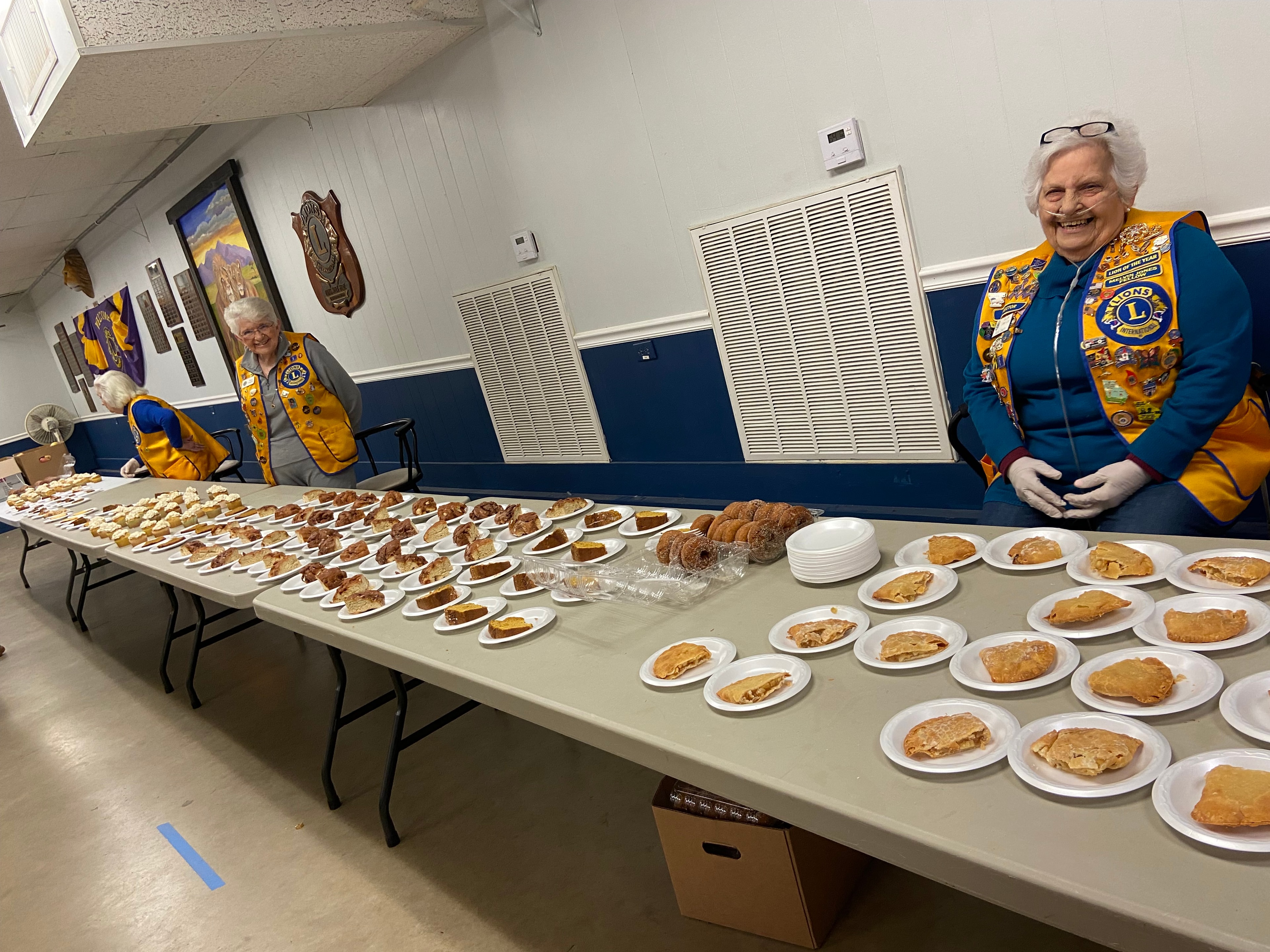 Table full of homemade pies and desserts at a Lions Club monthly meeting