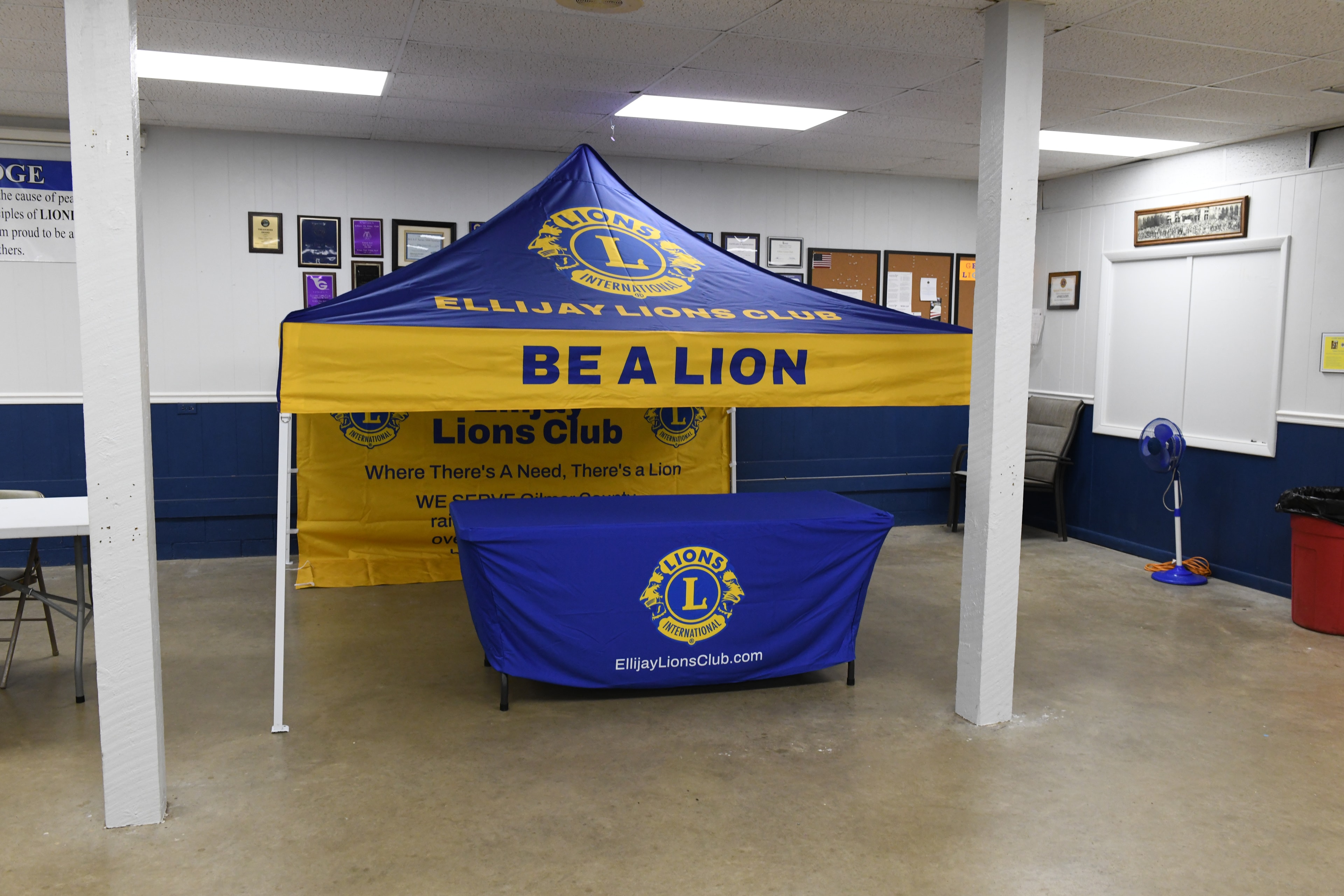 Ellijay Lions Club tent and table display inside the meeting hall