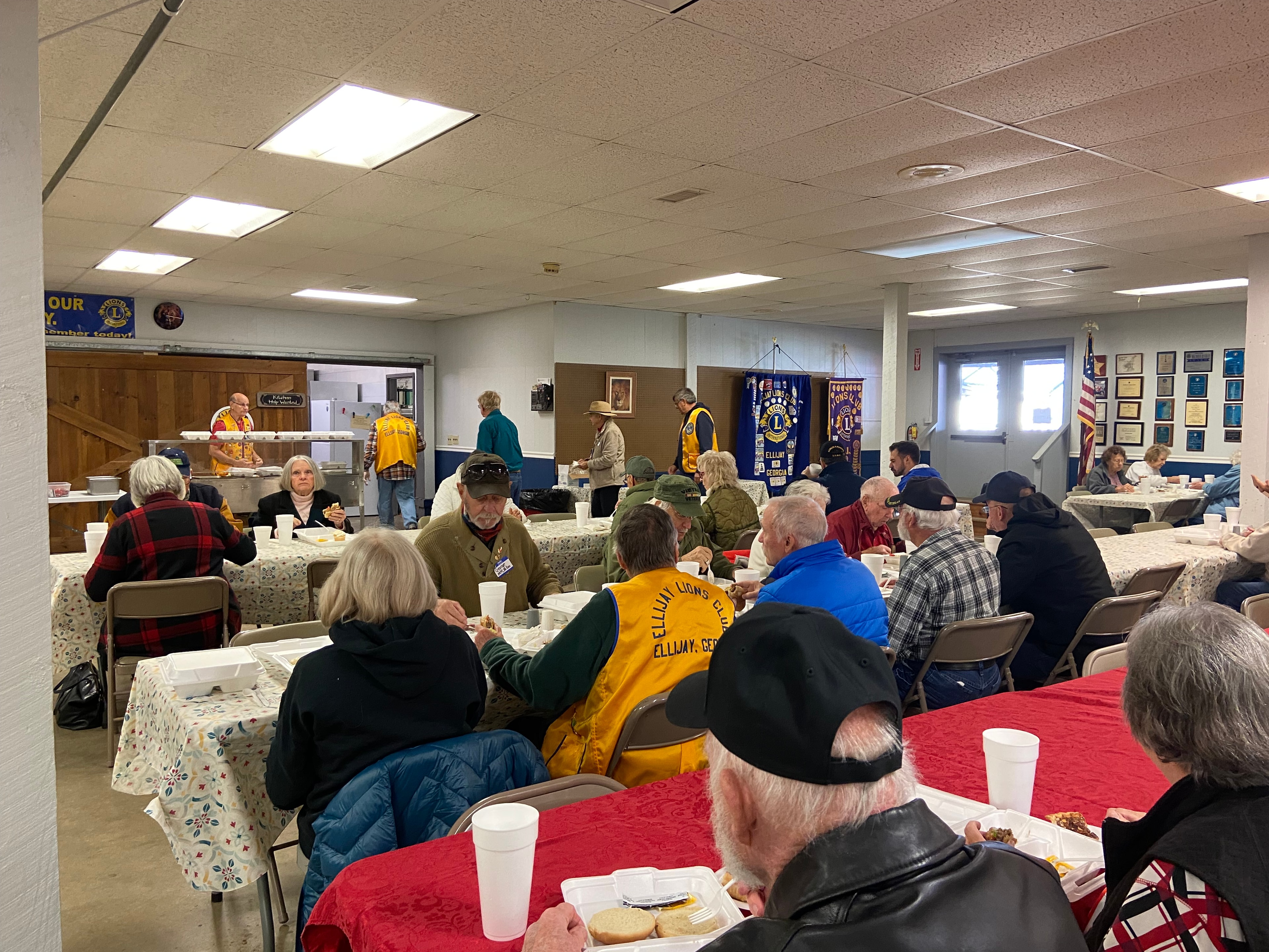 Lions Club members seated together at a monthly meeting