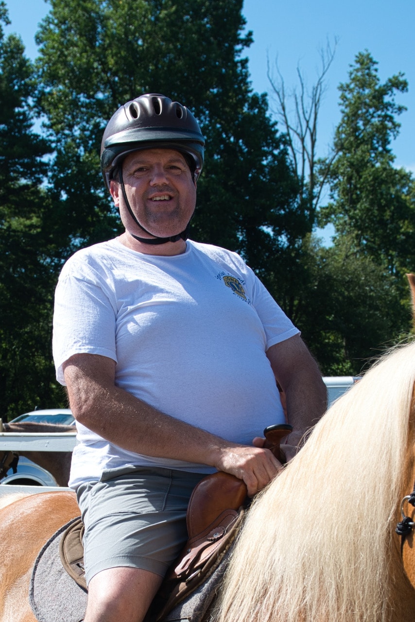Participant riding horse at Special Friends event
