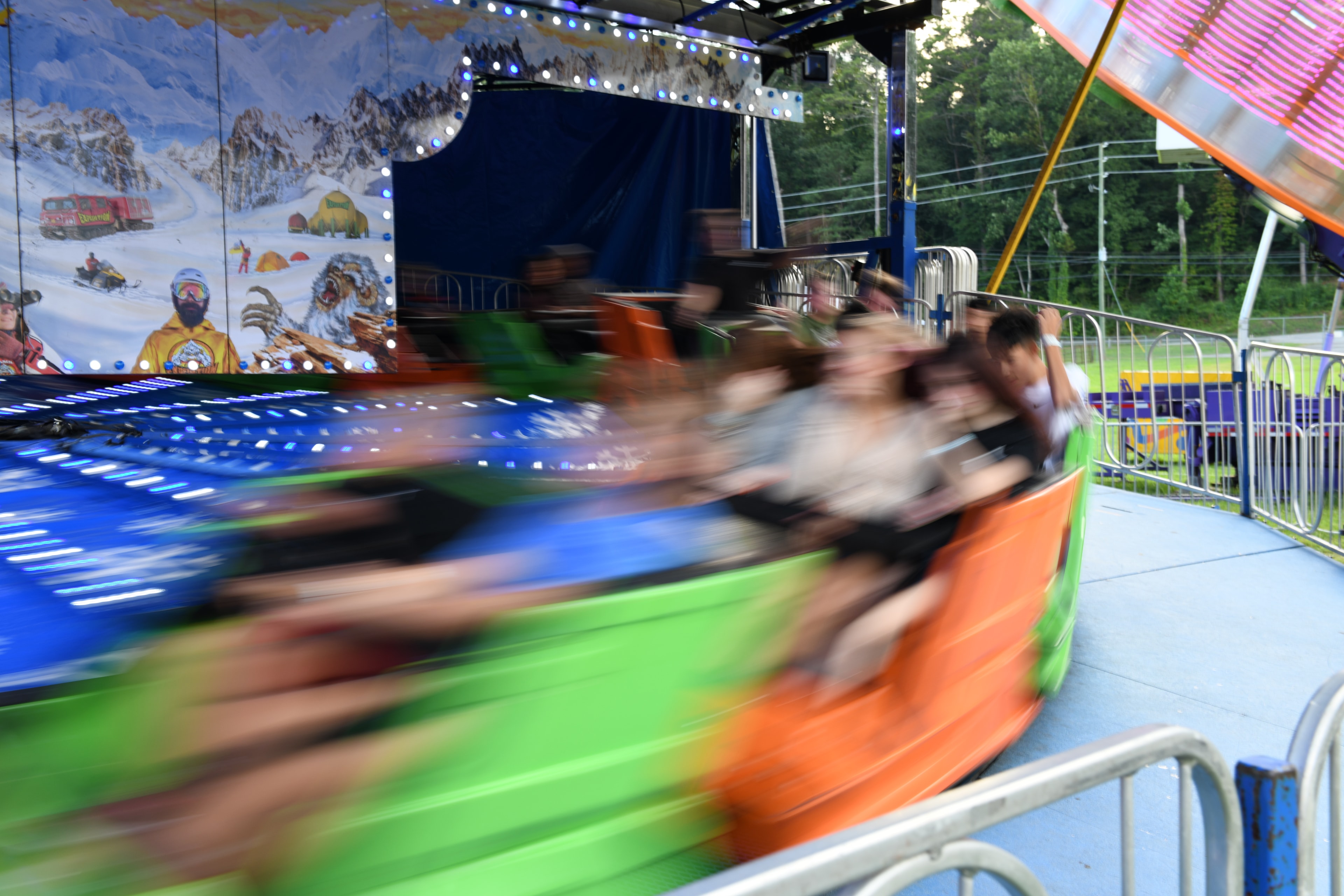 Spinning amusement park ride with passengers at the Gilmer County Fair
