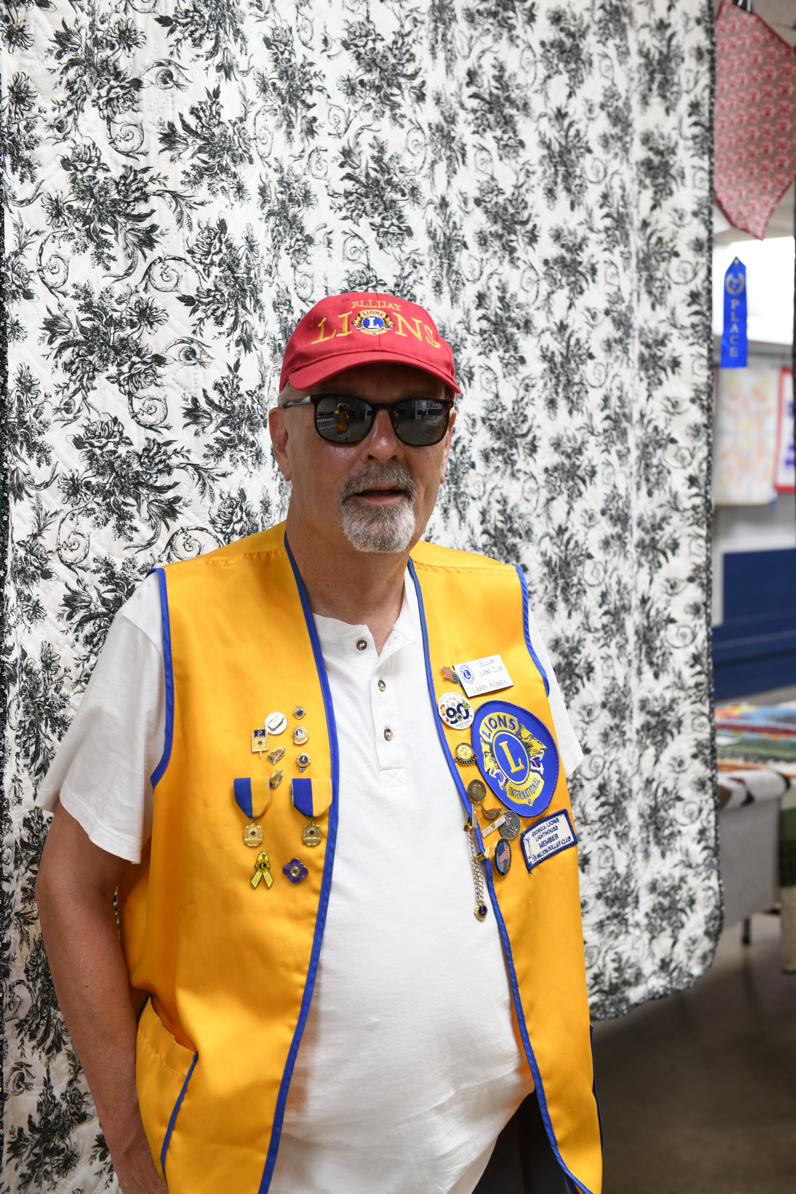 Ellijay Lions Club member wearing decorated vest at the Gilmer County Fair