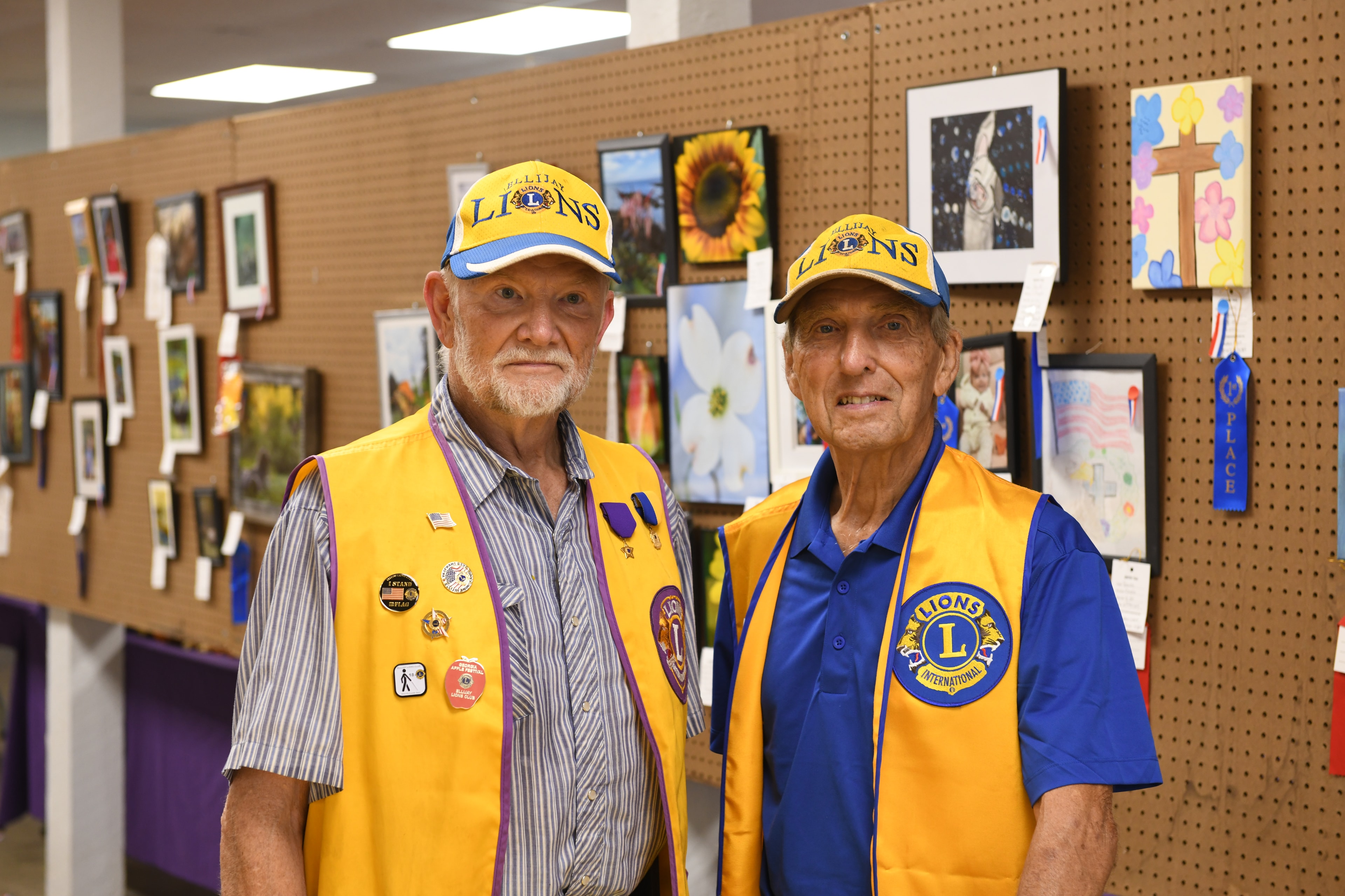 Two Ellijay Lions Club members at the art exhibition