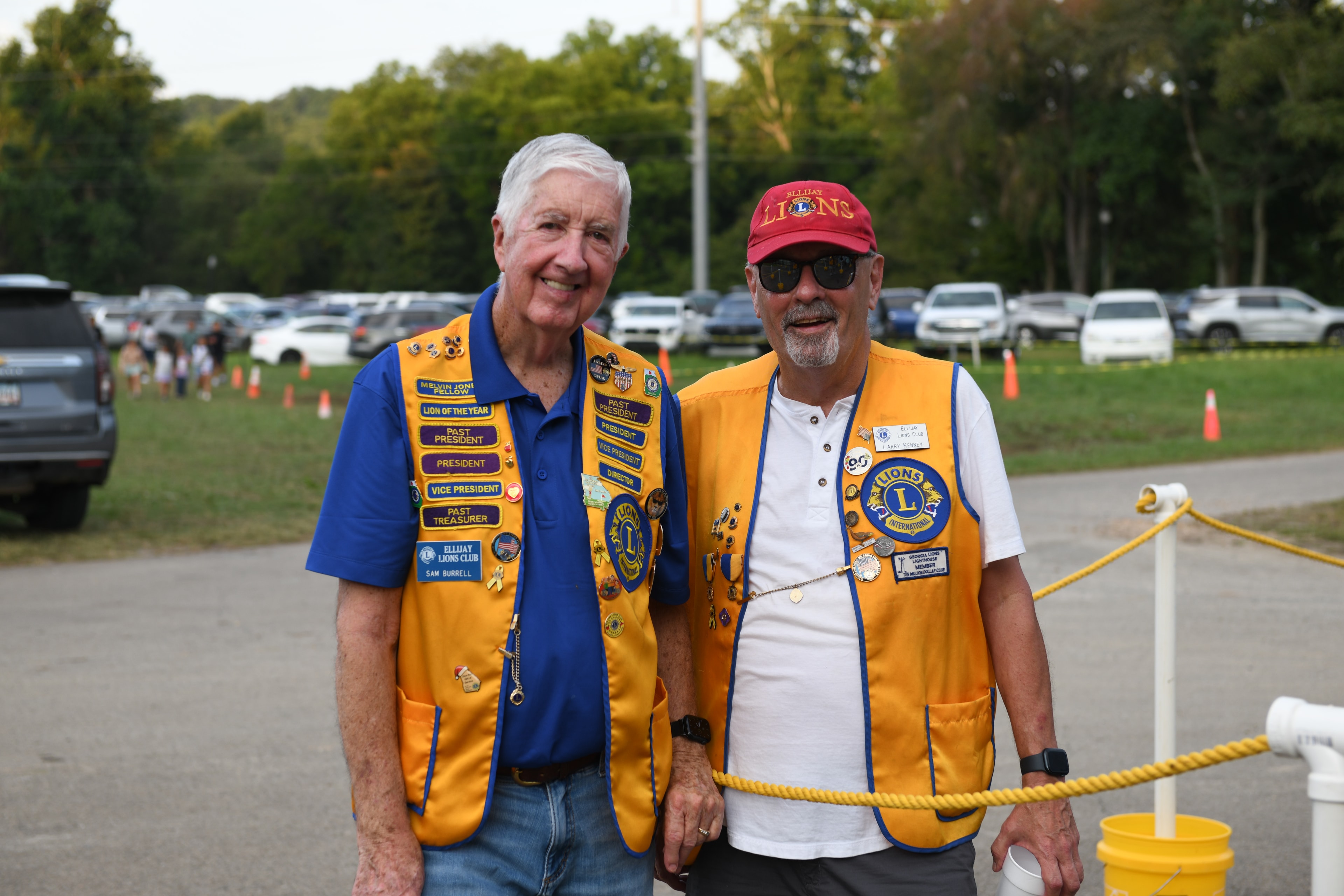 Two Ellijay Lions Club members posing outdoors at the Fair