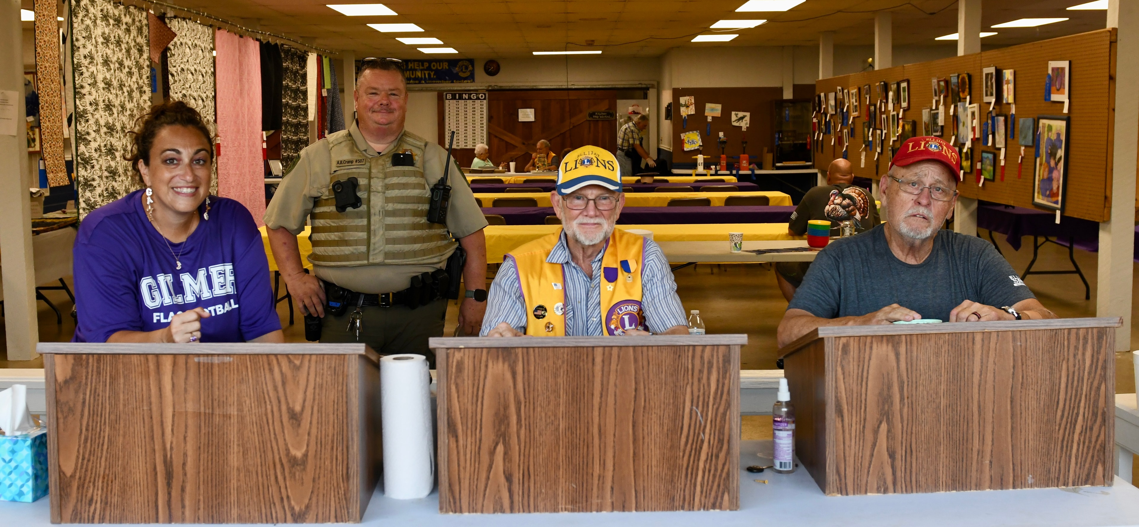 Community volunteers posing at the bingo hall counter